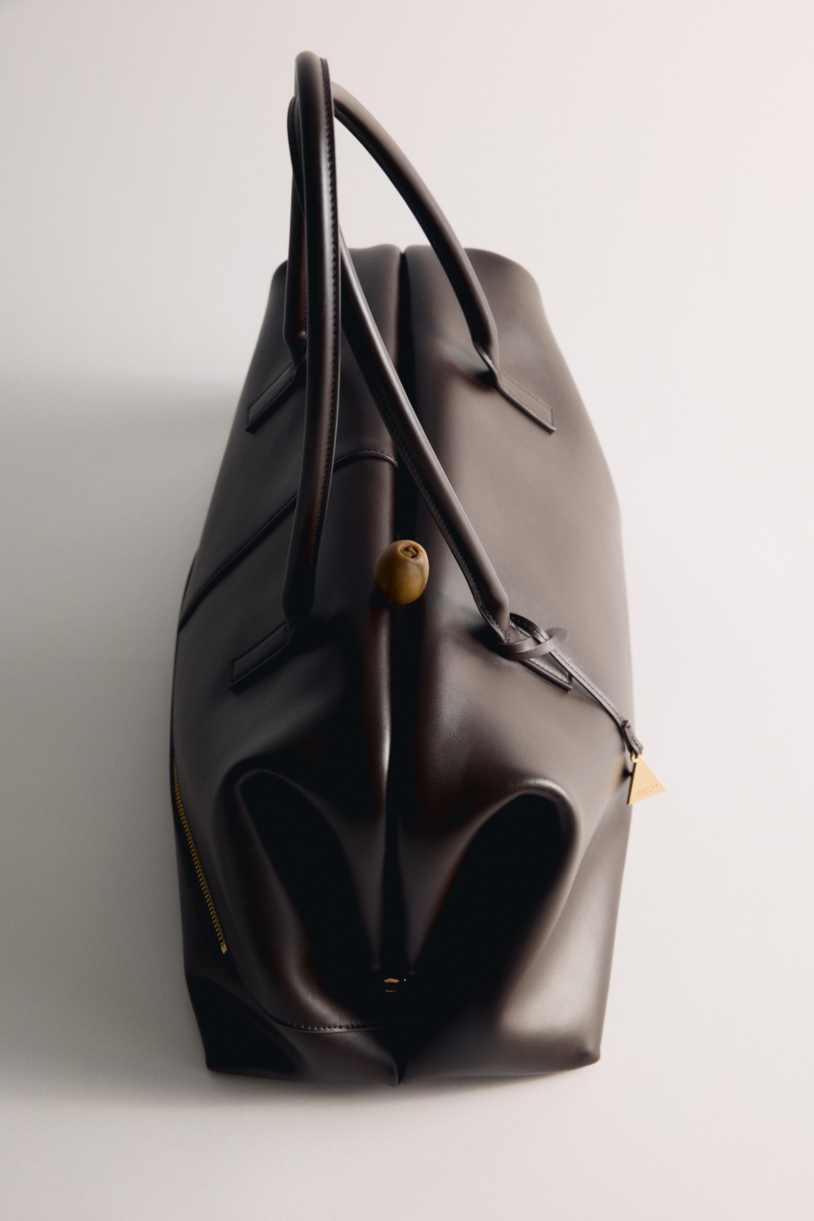 Chocolate Club Large Handbag on a light gray background