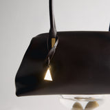 Chocolate Medium Club Shoulder Handbag with a gold handle and clasp on a white background