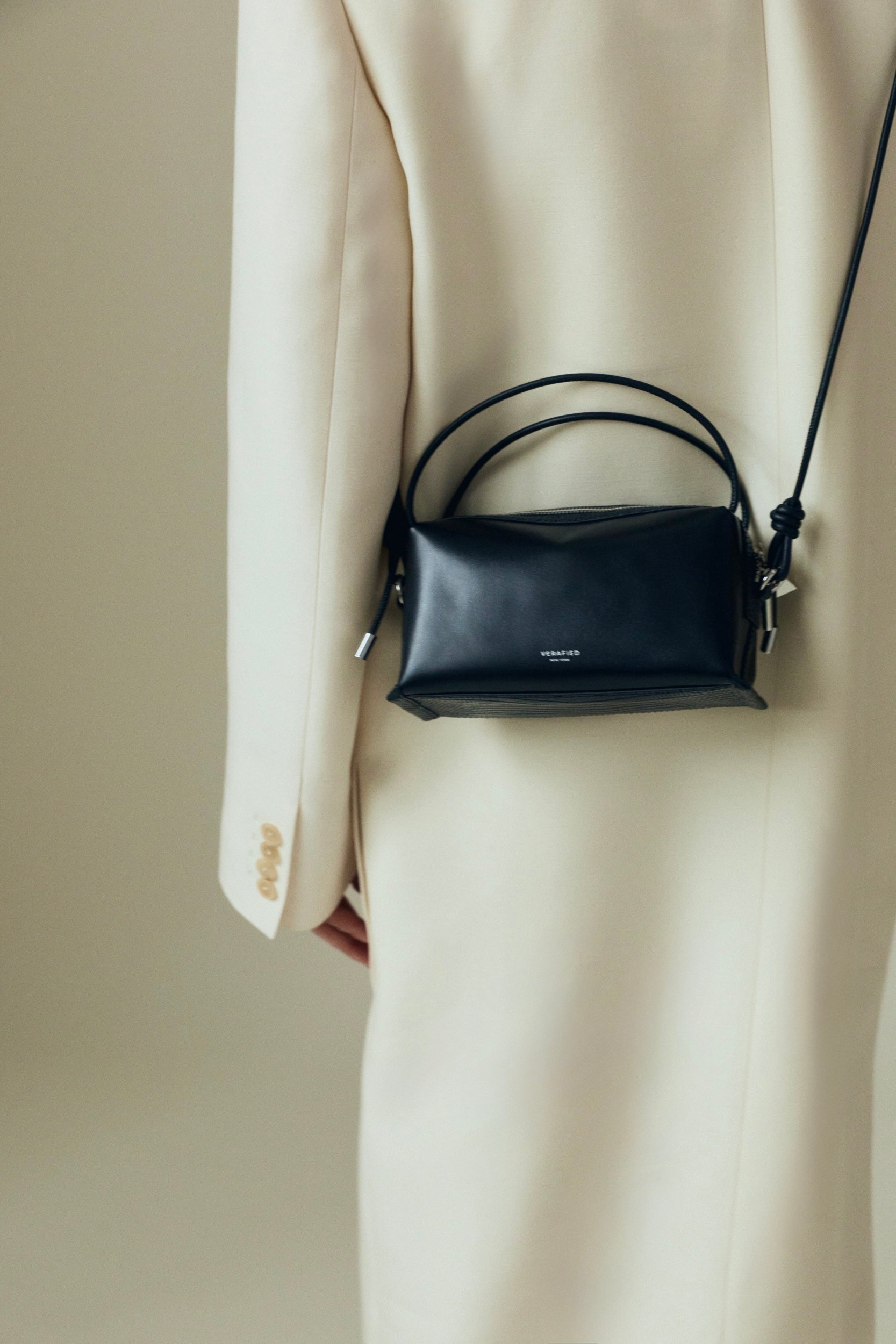 Verafied New York Black Lizard Café Mini Handbag worn over shoulder against a neutral background