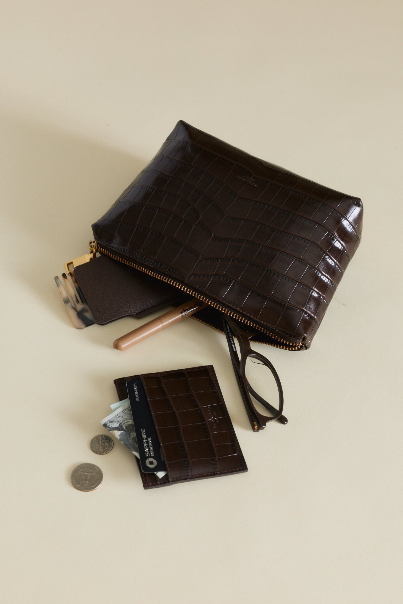 Mocha Croc Makeup Pouch and cardholder on a beige background