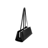Black handbag with a long strap on a white background